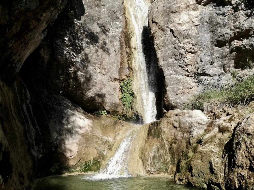 Barranc de Merea, a 10-metre waterfall between rocks, at the end a natural swimming pool