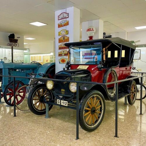 Antique car, black bonnet, bright red sides