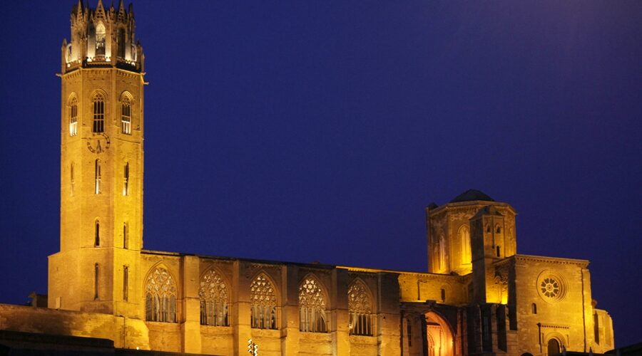 Silhouette of the cathedral of La Seu Vella de Lleida in the twilight and with all the artificial lighting on, to highlight its spectacular image even more.